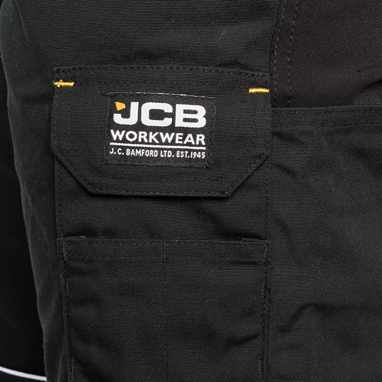 detail JCB Trade Hybrid Stretch černé pánské pracovní kalhoty
